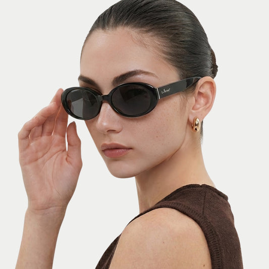 Model adjusting Riva Black oval polarized sunglasses