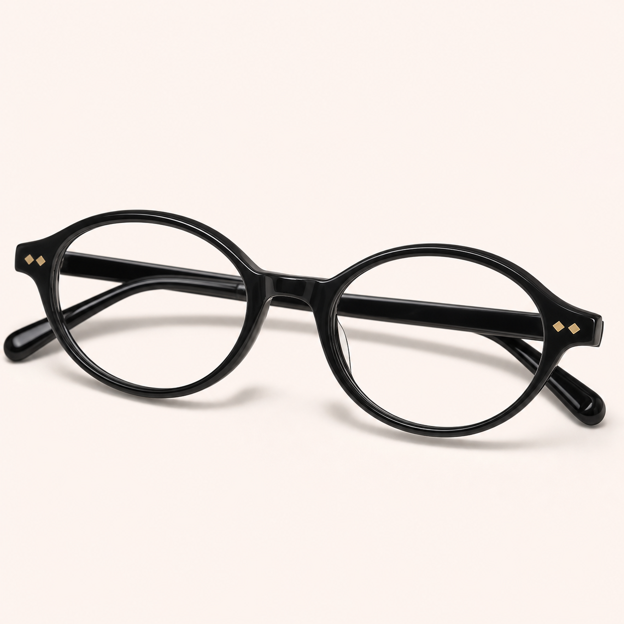 Black round eyeglasses with gold diamond rivets representing Le Seven round frames