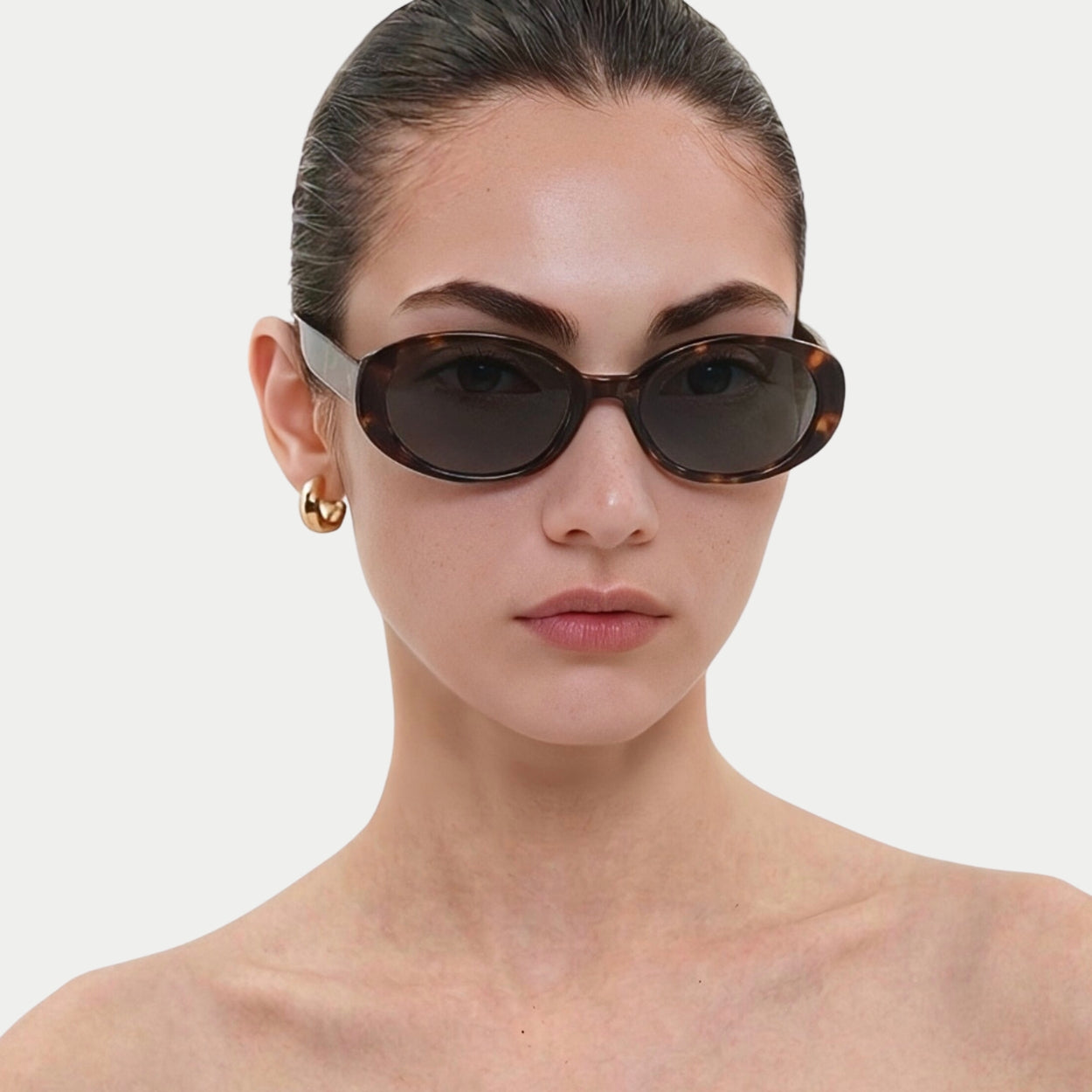 Model wearing Riva Black oval polarized sunglasses, front view