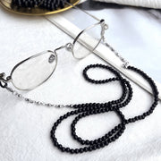 Black beaded eyeglass chain attached to eyeglasses, product view