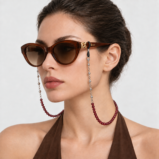Model wearing Burgundy beaded eyeglass chain with Mira Caramel sunglasses, draped beside and behind the neck