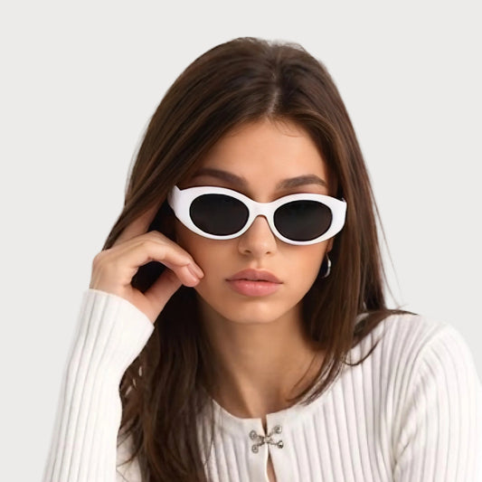 Model wearing Bella White oval polarized sunglasses, front view on light gray