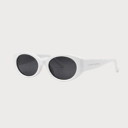 Bella White oval polarized sunglasses, three-quarter front-side product view on light gray