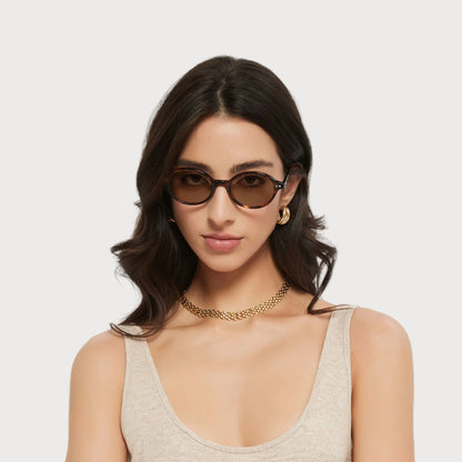 Model wearing Isla Brown Tortoise oval sunglasses