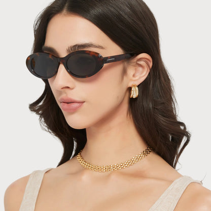 Jade Brown Tortoise oval sunglasses on model, side angle