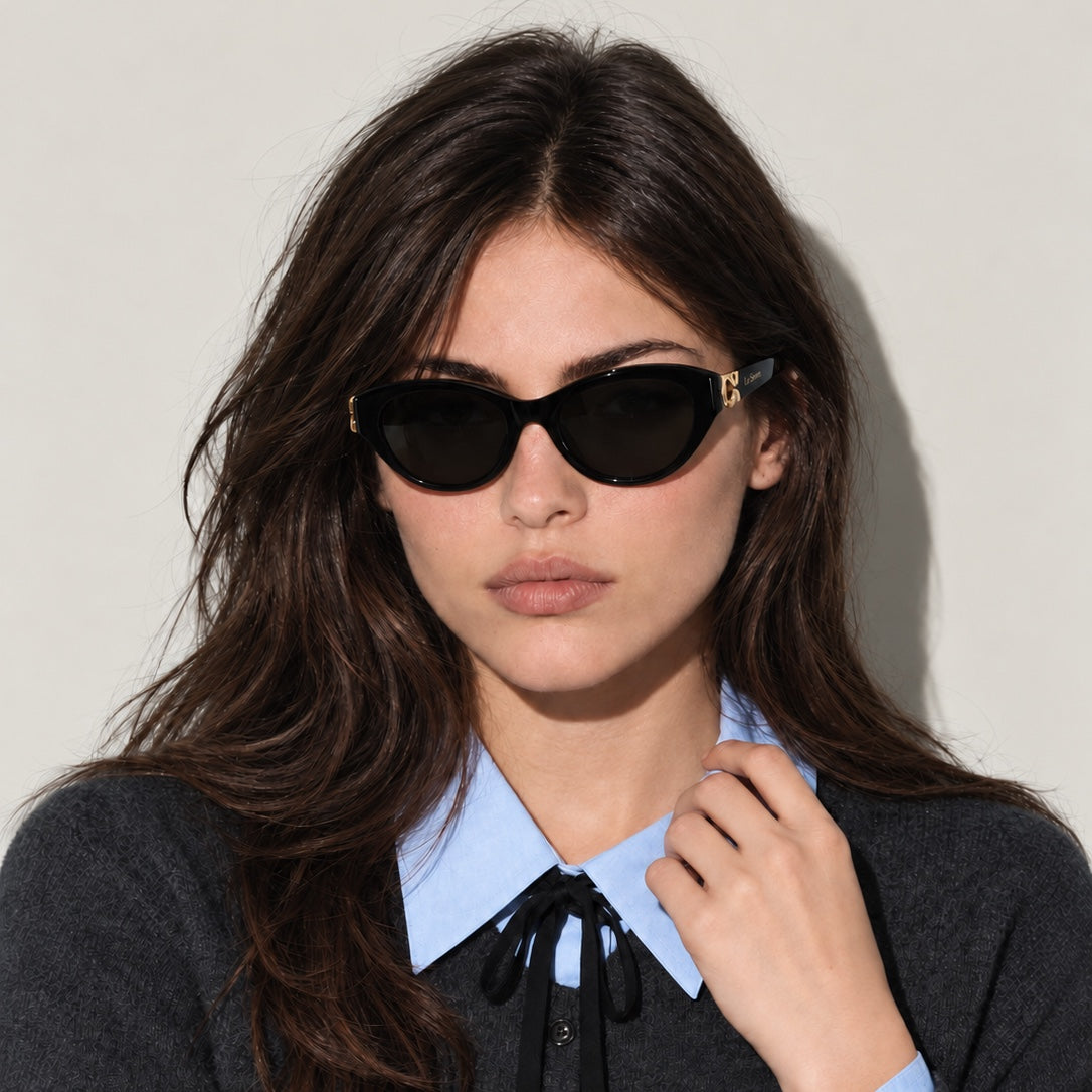 Mira Black sunglasses worn by a model, front view.