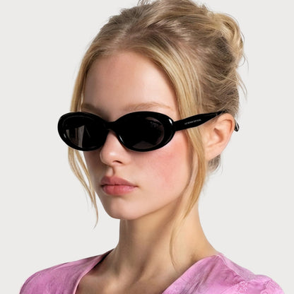 Model wearing Sedona Black oval sunglasses