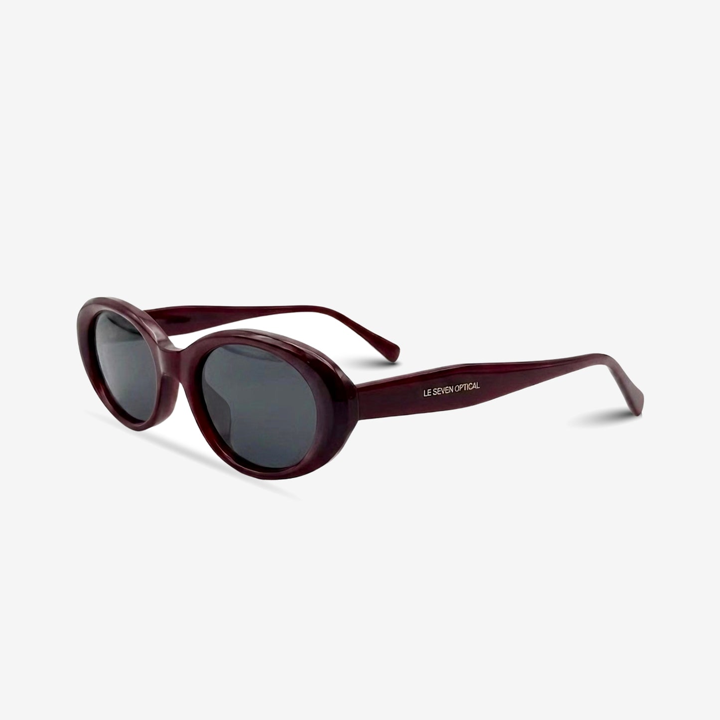 Sedona Burgundy oval sunglasses, three-quarter view on white