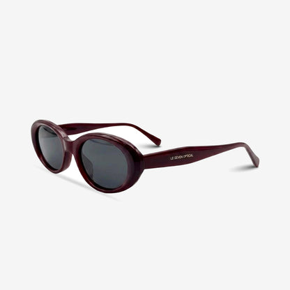 Sedona Burgundy oval sunglasses, three-quarter view on white