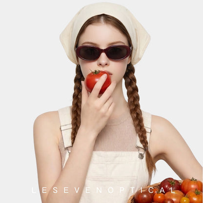 Model wearing Sedona Burgundy oval sunglasses