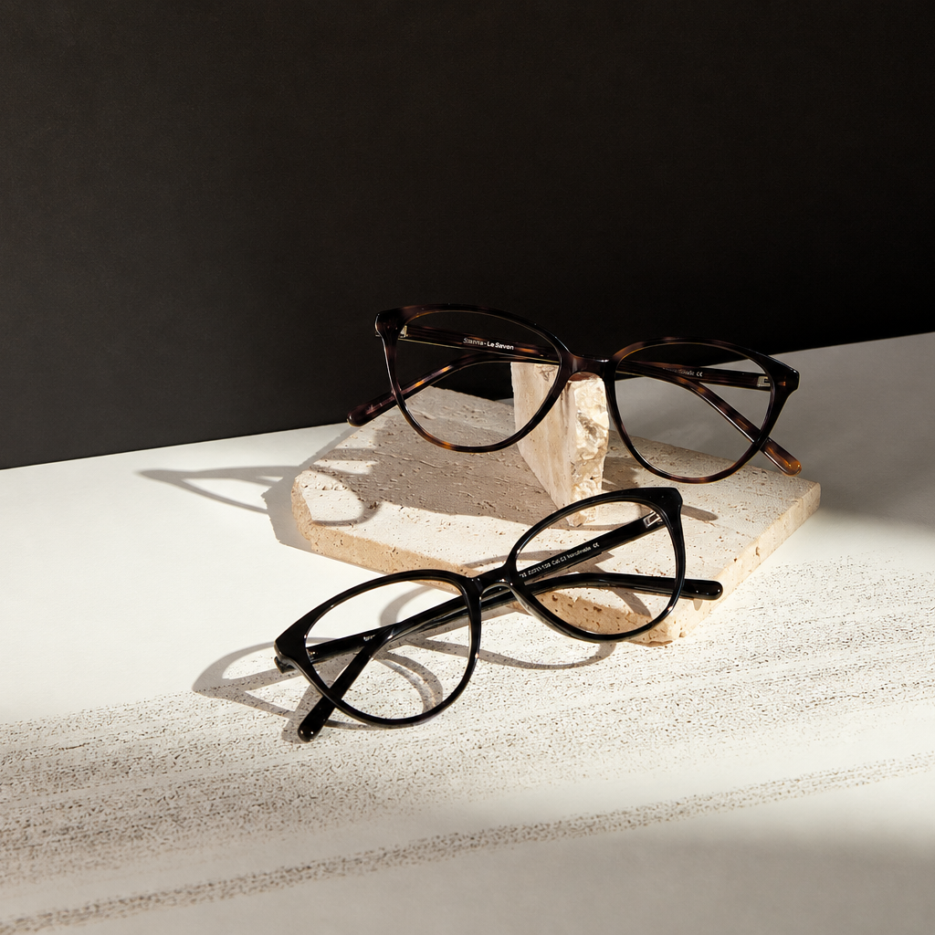 Sienna cat-eye optical frames in tortoise and black displayed on stone