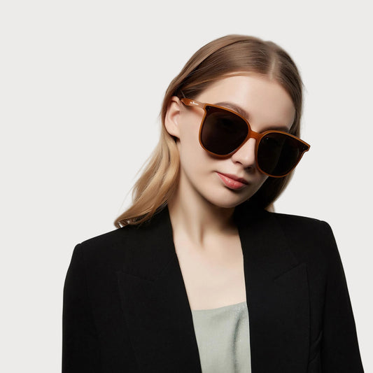 Model wearing Amara Brown square sunglasses, angled view