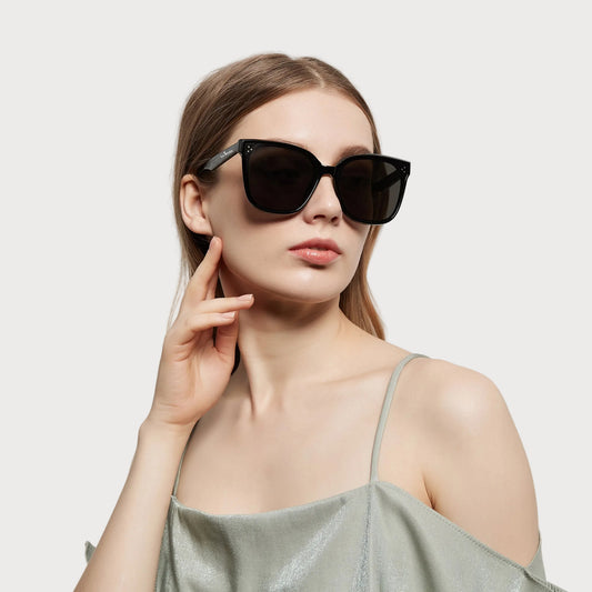Model wearing Celeste Black oversized square sunglasses
