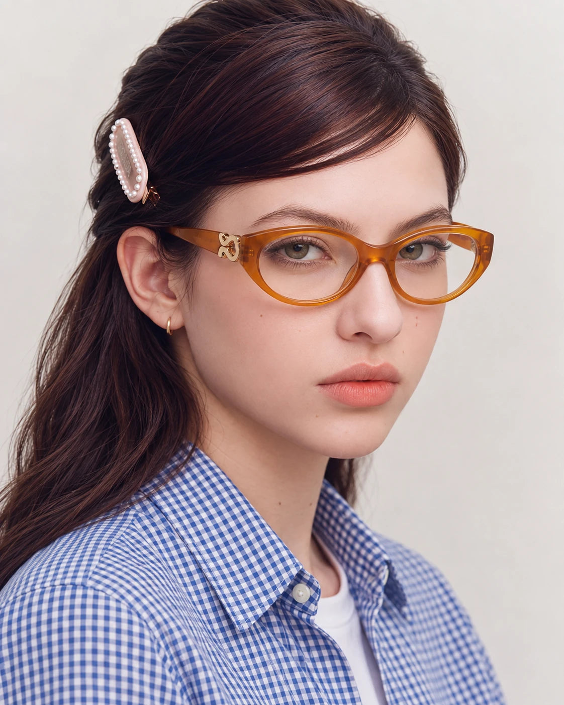 Model wearing LE SEVEN Kora eyeglasses in Pumpkin, alternate angle